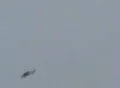 Black helicopter flying overhead -part A Video