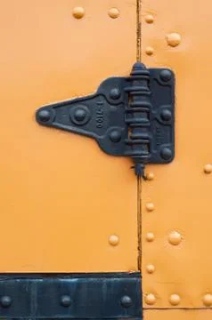 Black hinge on yellow Stock-Fotos