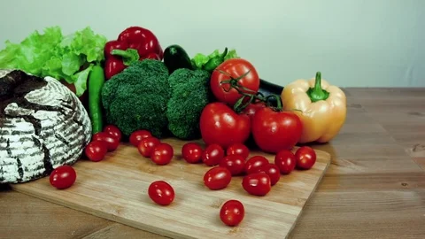 Black homemade rye bread and fresh vegetables. Stock Footage 83999750