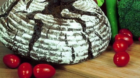 Black homemade rye bread and fresh vegetables. Stock Footage 84000142
