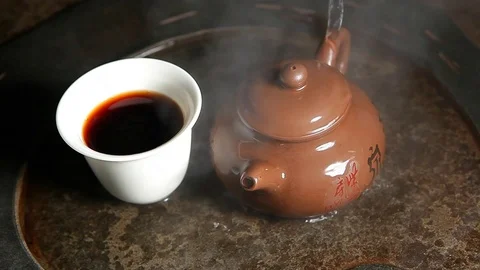 Black hot tea cup stone background hd footage Stock Footage 121093512
