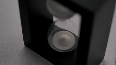 Black hourglass. A device for measuring time intervals 스톡 동영상 124363831