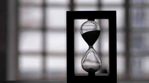 Black hourglass. A device for measuring time intervals Stock Footage 124363854