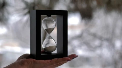 Black hourglass. A device for measuring time intervals Stock Footage 124364247