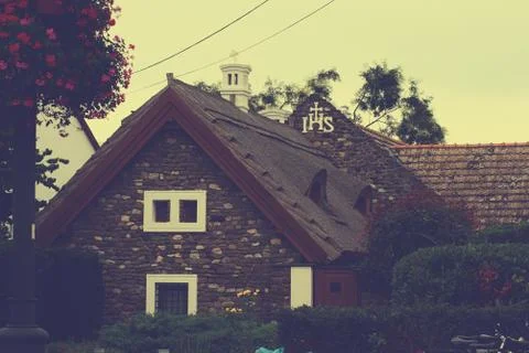 A black house with trees in the background Stock Photos