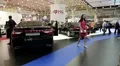 Black Hyundai Grandeur and Hyundai Genesis at automotive-show HD Footage