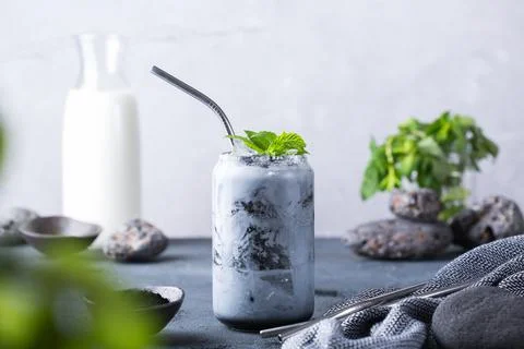 Black iced activated charcoal latte, detox drink Stock Photos