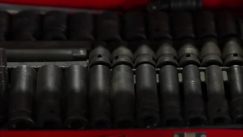 Black impact socket set neatly arranged in a red case. Stock Footage 343892447