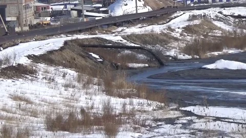 Black industrial waste flows out of the pipe Stock Footage 75563004
