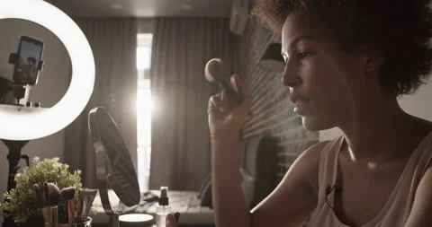 Black influencer giving makeup application tips Stock Footage 214979143