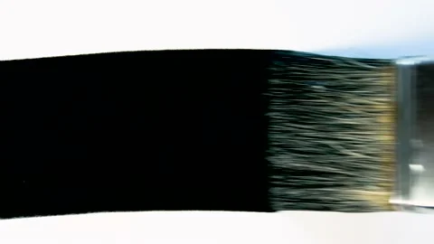 Black ink brush strokes. Close up of artist hand painting with black paint. Video stock 154574346