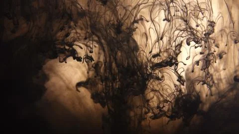Black ink clots fall and dissolve in water in slow motion. Abstract backgroun Illustrazione stock