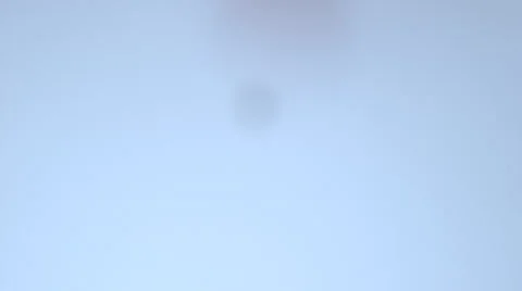 Black ink drop falling in water Stock Footage 46667294
