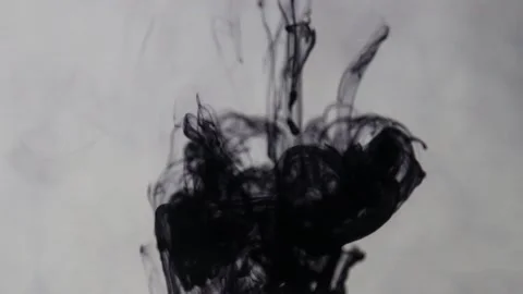 Black ink drop spread in water and makes beautiful pattern in water Stock Footage 153310234