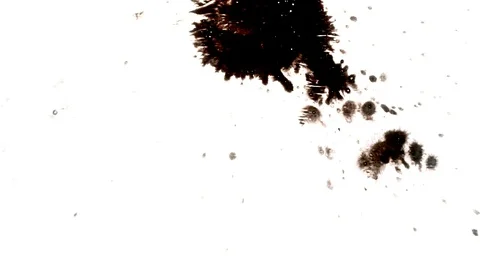 Black ink drops splatters spilling on white background Video stock 125471844