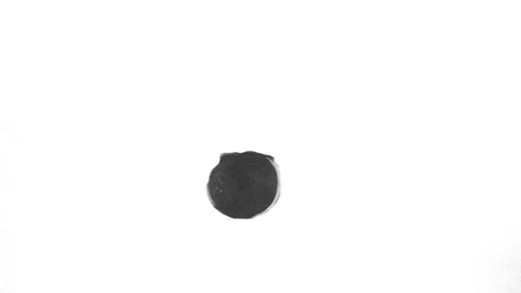 Black ink drops splatters spilling on white background Video stock 125472153