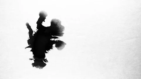 Black ink drops splatters spilling on white background Stock Footage 125474665