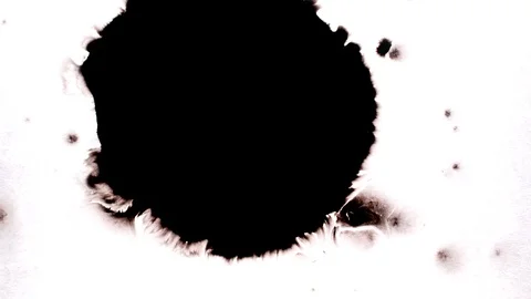 Black ink drops splatters spilling on white background 動画素材 125475089