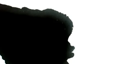 Black ink drops splatters spilling on white background Stock Footage 125475486