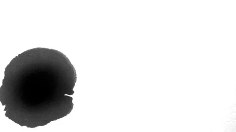 Black ink drops splatters spilling on white background Stock Footage 125475582