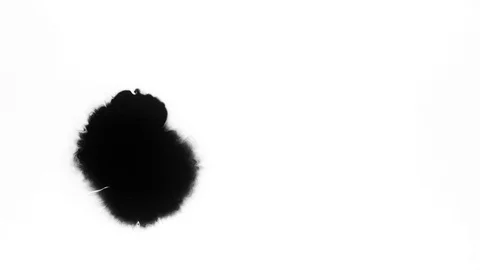 Black ink drops splatters spilling on white background Stock Footage 125477284