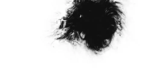 Black ink drops on white paper background Vidéo 37117328