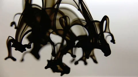 Black ink falling in the water. Macro background video. Stock Footage 123288073