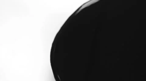 Black ink flowing over white background transition Stock Footage 54427461