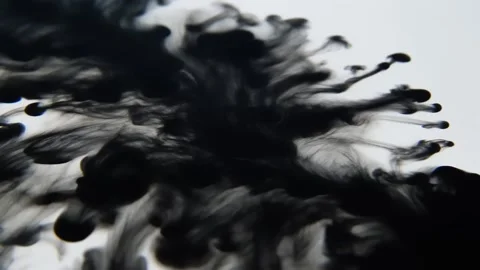 Black ink forms rough spatter with jagged textures across white surface Stock Footage 308731187