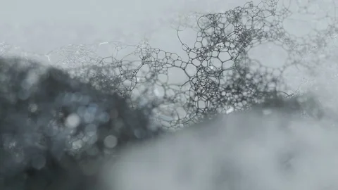 Black Ink Mixing With Soap Bubbles Stock Footage 126908802