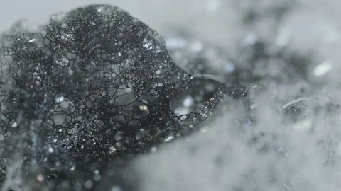 Black Ink Mixing With Soap Bubbles Stock Footage 126910304