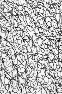 Black ink scribble abstract pattern on white paper. Photos