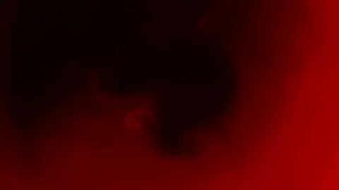 Black ink in water on a red background Stock Footage 102709246