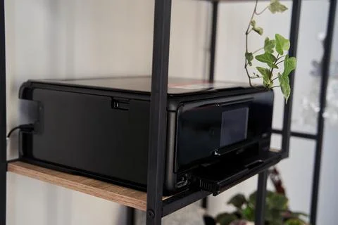 Black inkjet printer is on the shelf Stock Photos