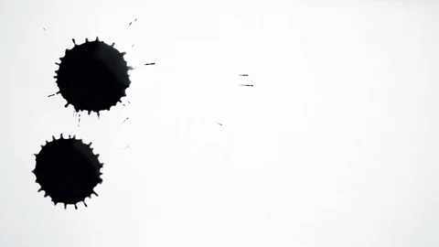 Black inks drops splash on white paper, abstract background Stock Footage 90224070