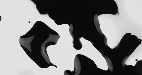 Black inks drops on white background Video stock 125974110