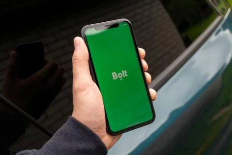 Black iphone with logo of Bolt application on the screen. Stock Photos