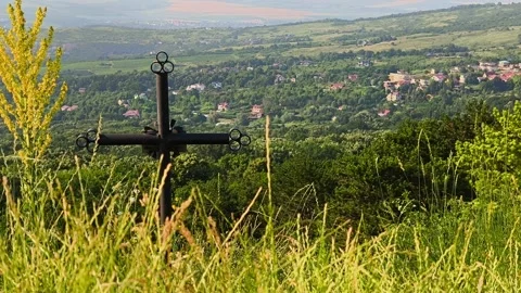 Black iron cross on the edge of a cliff with a panoramic view. Stock Footage 339024147
