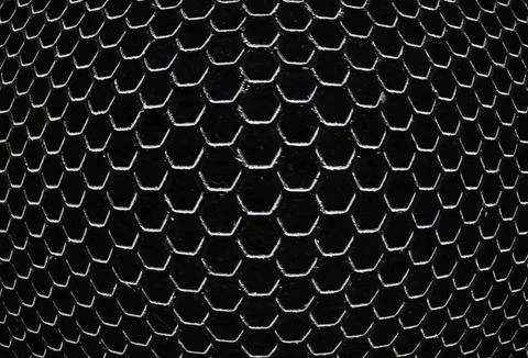 Black iron hexagonal texture. Industrial background Stock Photos