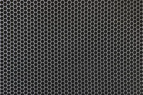 Black iron speaker grid texture. Industrial background. Stock Photos