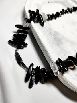 Black irregular black agate beaded gemstone necklace on white Stock Photos