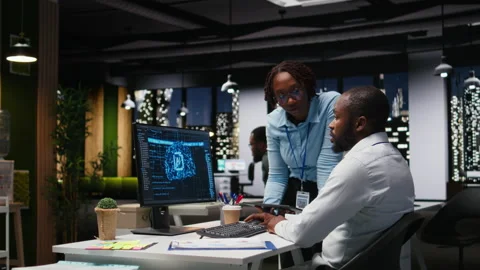 Black IT consultants workers use AI big data and predictive analytics Stock Footage 318498589