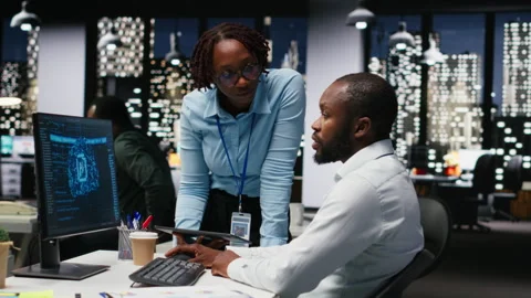 Black IT consultants workers use AI big data and predictive analytics Video stock 318564381