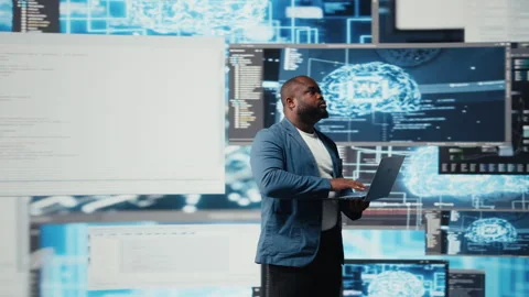 Black IT engineer working in a digital environment with programming language Stock Footage 312413993
