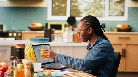 Black IT engineer working remotely coding on laptop and programming scripts Vídeos de archivo 344246756