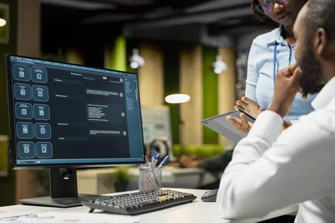 Black IT engineers team developing app and software algorithm on pc Stock Photos