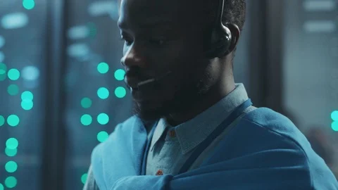 Black IT server support engineer typing on digital tablet activating system Stock Footage 119783327