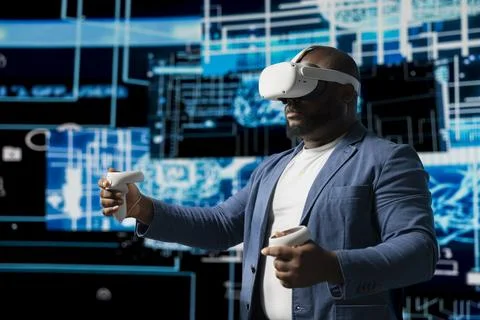 Black IT technician working on deep learning with virtual reality headset 写真素材