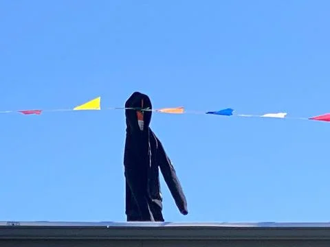 Black jacket worn on a stick Stock Photos