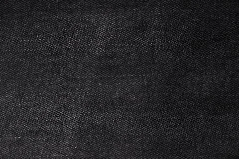 Black jeans macro texture background. Place for your text. Stock Photos